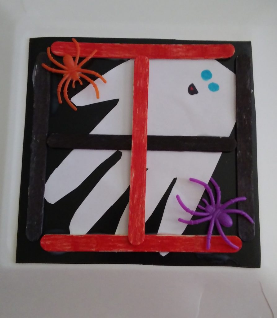 popsicle stick craft ghost in window